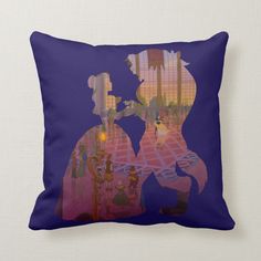 a pillow with an image of a man and woman in silhouettes on the floor