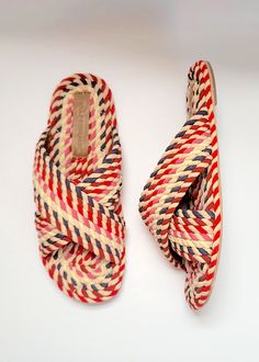 our 100% vegan rope slide made from natural plant based fabric - woven into ropes and hand-applied for a very unique sandal slide in an array of beautiful reds, pinks and naturals. Outsole is made from durable TPR.Upper: FabricLining: Vegan PUInsole: FabricOutsole: TPRNew and Improved fitting! Fit has been adjusted from last year and fit is now true to size- length is about 1/4 inch longer than last year.Made In India Classic Wardrobe Basics, Trend 2025, Sustainable Shoes, Pretty Shoes Sneakers, Hot Boots, Woven Sandals, Handmade Sandals, Our Values, Sustainable Business