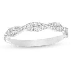 Little and lovely, this diamond band is a shimmering must-have. Fashioned in 14K white gold, this elegant look features twist ribbons lined with sparkling diamonds. Captivating with 1/4 ct. t.w. of diamonds and a bright polished shine, this stackable ring is a treat for the eyes. Elegant Diamond Bands For Anniversary, Double Wedding Band Zales, Modern Twist Diamond Stackable Rings For Anniversary, Elegant White Diamond Eternity Band, Elegant White Bands With Brilliant Cut, White Diamond Ring With Modern Twist For Formal Occasions, Elegant Diamond Bands With Pave Setting, Modern Twist White Diamond Ring For Anniversary, Elegant Diamond White Bands With Diamond Accents