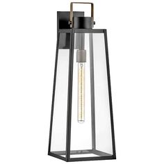 an outdoor light fixture with a clear glass and metal frame