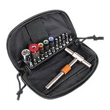 an assortment of screws in a black case with zippered pouch on white background