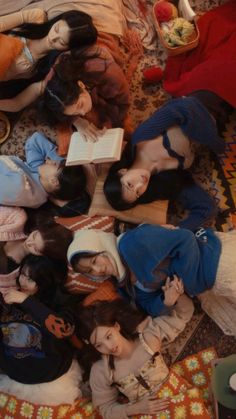 a group of dolls laying on top of a bed next to each other in a room