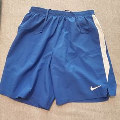 Blue Nike Jogging Shorts Originally Bought For Track But They Don't Fit. Blue Stretch Bottoms For Jogging, Nike Blue Bottoms With Elastic Waistband, Nike Stretch Blue Bottoms, Sporty Blue Bottoms For Jogging, Blue Sportswear Bottoms For Spring, Blue Gym Pants For Spring, Spring Blue Athletic Pants, Blue Pants For Gym In Spring, Nike Blue Casual Activewear