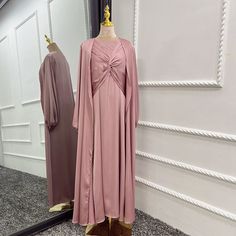 This Lux Two Piece Set is made from high-quality satin, and includes a long sleeve inner dress with chest design and a long sleeve open abaya in a matching color. Available in 6 beautiful colors. Evening Satin Maxi Abaya, Evening Satin Maxi-length Abaya, Elegant Solid Color Abaya For Eid, Evening Solid Maxi Length Abaya, Evening Solid Color Maxi Length Abaya, Evening Maxi Length Solid Abaya, Wedding Dresses For Eid, Elegant Silk Abaya For Eid, Satin Evening Abaya For Eid