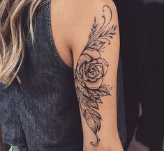 a woman with a rose tattoo on her arm