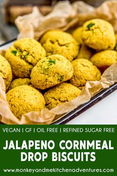 a tray full of jalapeno cornmeal drop biscuits with text overlay