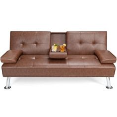 a brown leather couch sitting on top of a metal frame