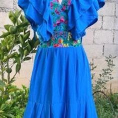 Beautiful Floral embroidered Mexican dresses , handmade in Chiapas, México.  Perfect for your bridesmaid, different embroidered colors.   We have sizes S to XXL Colors: blue, black, pink,beige, red Please send me a message with the color and size are you looking for.    Our products are hand-crafted using traditional techniques, maintaining their local artisanal skills. Minimal variations of color and design may exist in handmade pieces. Traditional Blue Fiesta Dress, Traditional Blue Ruffled Dress, Traditional Blue Dress With Ruffles, Blue Ruffled Dresses For Festival, Blue Embroidered Summer Wedding Dress, Bohemian Embroidered Fiesta Dresses, Bohemian Ruffle Dress For Fiesta, Bohemian Ruffled Dress For Fiesta, Floral Embroidered Beach Dress For Fiesta