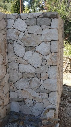 a stone wall made out of rocks and cement