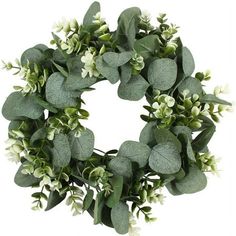 a wreath with green leaves and white flowers