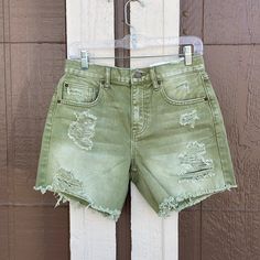 Distressed Drop Waist Spring Green Washed Bottoms, Ripped Green Cotton Bottoms, Trendy Green Distressed Bottoms, Green Summer Bottoms With Frayed Hem, Casual Green Bottoms With Frayed Hem, Summer Green Bottoms With Frayed Hem, Trendy Green Bottoms With Frayed Hem, Casual Distressed Bottoms For Beach, Spring Green Bottoms With Frayed Hem