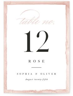 a table number card with the numbers twelve and twelve