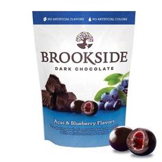 brookside dark chocolate with blueberries and raspberries in the bag next to it