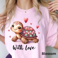 "💚 🐢 Dive into the sea of love with our Comfort Colors Lubby Dubby Turtle T-shirt, the perfect Valentine's Day treat. Crafted for comfort and adorned with a whimsical turtle design, this tee captures the essence of love and playfulness. The Lubby Dubby Turtle, with its heart-shaped shell, symbolizes the deep connection and affectionate bond shared between loved ones. Embrace the cozy softness of Comfort Colors as you celebrate the season of love. Whether it's a thoughtful gift for your significant other or a delightful addition to your Valentine's Day wardrobe, this charming turtle tee is a delightful expression of affection and comfort. ❤️🌹💖 Key Features: - Premium Comfort Color Shirt - 100% Ring-Spun US Cotton - Relaxed Fit for All-Day Comfort - Classic Crew Neckline - Pre-Shrunk Fab Printed Pink T-shirt As Gift, Pink Printed T-shirt As A Gift, Turtle Valentines, Valentine's Day Fun Short Sleeve T-shirt, Spiritual Turtle-shaped Jewelry Gift, Playful Pink T-shirt For Valentine's Day, Valentine's Day Gift Ideas, Turtle Design, Deep Connection