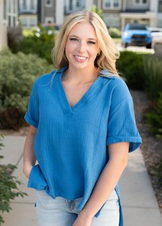 Blue collared top with a high low hem Relaxed Blue Blouse For Spring, Relaxed Blue V-neck Top, Relaxed Fit Split Neck Top For Day Out, Oversized Blue V-neck Tops, Collared Top, In Between, Vibrant Blue, High Low Hem, Long Length