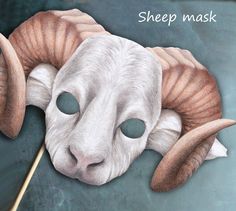 a sheep mask with long horns on it's head and the words sheep mask written in white