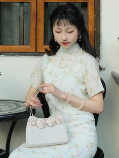 A stunning (and fully customizable) qipao, made from 100% ramie plant fiber and lined with pure cotton. The Yi Xiao 伊笑 Carefree Qipao offers a breathable and lightweight feel that's perfect for any occasion. The double-layered design means there's no need for a petticoat, one less layer to worry about! The light blue color, adorned with a delicate floral print, adds a touch of subtle charm and grace. Ideal for garden parties, casual outings, or an evening event, this dress combines timeless styl Hanfu Men, Modern Hanfu, Fan Jewelry, New Chinese Style, Plant Fibres, Light Blue Color, Layers Design, Chinese Style, Petticoat