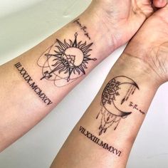 two people with tattoos on their arms holding each other's hands and looking at the sky