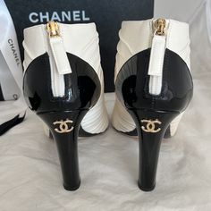 Authentic, Chanel, Interlocking Cc Logo Short Boots. These Gorgeous Boots Feature Five Front Bows In A Soft, Supple Lambskin Leather. Back Zip With Leather Zipper Pull. Heel Is Black Patent With Double Cc Logo. All Golden Hardware. Open Toe. Cushioned Footbed For Ultimate Comfort. No Damages At All To These Beauties. No Scuffs To Heels, Minimum Wear To Heel Lifts. Leather Has No Scratches, Stains Or Odor. No Toe Or Heel Impressions. Lightweight And Very Comfortable. Barely Worn And In Pristine C Bow Shorts, Leather Zipper, Chanel Shoes, Black Cream, Short Boots, Lambskin Leather, Open Toe, Bootie Boots, Heel Height