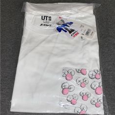 *Nwt* Kaws X Uniqlo Collaboration T- Shirt (Pocket) Size: Small **Purchased From Uniqlo Drop** - Authenticity Guaranteed - Item Comes Brand New And In Original Packaging - No Returns Refunds Or Exchanges On Final Sale Items Thanks For Looking As Always And Feel Free To Message With Any Questions! White Short Sleeve Tops With Patch Pockets, White Short Sleeve Shirt With Patch Pockets, White Relaxed Fit Top With Patch Pockets, White Tops With Patch Pockets In Relaxed Fit, Relaxed White Tops With Patch Pockets, White Cotton Tops With Pockets, White Cotton T-shirt With Side Pockets, White Casual T-shirt With Side Pockets, White T-shirt With Pockets In Relaxed Fit