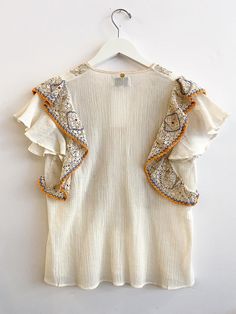 Antik Batik Colas Tee - Cream Spring Embroidered Ruffle Sleeve Blouse, Embroidered Ruffle Sleeve Tops For Summer, Beige V-neck Top For Festival, Embroidered Ruffle Sleeve Summer Tops, Cotton Tops With Floral Embroidery And Ruffle Sleeves, Cotton Top With Floral Embroidery And Ruffle Sleeves, Cotton Top With Ruffle Sleeves And Floral Embroidery, Chic Summer Embroidered Top With Ruffles, Chic Embroidered Ruffle Top For Summer