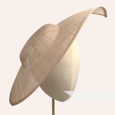 Get Royal Ascot ready with this extra large pointed tip Latte Brown sinamay fascinator base! Made from a triple layer of stiffened sinamay millinery fabric and is ideal for making an instant hat. This shape has a lovely pointed tip and a shallow crown. Get creative by positioning it at different angles on the head! Just add a headband for securing to the head (not included but available in our shop!) *This is not a fitted hat! You will need to sew in a headband or comb to attach it to your head* Sinamay Fascinator, Blank Hats, Millinery Supplies, Hat Base, Large Hats, Fascinator Hat, Millinery Hats, Royal Ascot, Sew In