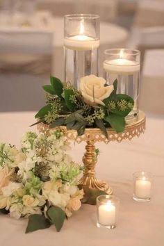 the centerpiece is adorned with flowers and candles