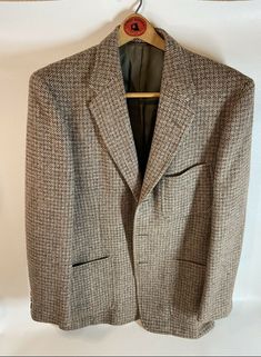 Mens Vintage blazer 44 (HarrisTweedofScotland). Jacket is in really good condition, super clean. From a clean smoke free home. Harris Tweeds from the Outer Hebrides of Scotland give you a wide range of some of the finest tweeds available in the world. Our Harris Tweeds are woven by the islanders at their homes in the Outer Hebrides and made of virgin wool dyed and spun on the islands. Formal Herringbone Blazer For Fall, Tweed Long Sleeve Blazer For Semi-formal Occasions, Long Sleeve Tweed Blazer For Semi-formal Occasions, Semi-formal Long Sleeve Tweed Blazer, Tailored Tweed Blazer With Houndstooth Pattern, Tweed Houndstooth Blazer With Notch Lapel, Plaid Wool Tweed Jacket For Tailoring, Business Casual Tweed Blazer With Lapel Collar, Elegant Fall Tweed Sport Coat