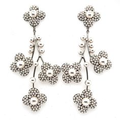 These cherry blossom chandelier earrings have a truly one of a kind motif. Every flower and leaflet cascading down is embedded with elegant studded pearls. This handcrafted pair will make a statement and catch everyone’s eye with their striking design and enchanting presence. -Genuine Crystals and Pearls Approximately 2in from widest point x 4.5in long (5.08cm x 11.43cm) Rhodium plated, non-tarnish finish for brilliance Custom Signature, Luxury Bridal, Bridal Headpieces, Chandelier Earrings, Bridal Style, Rhodium Plated, Cherry Blossom, Blossom, Dolce And Gabbana