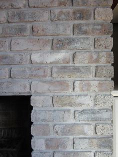 a brick fireplace is shown in this image