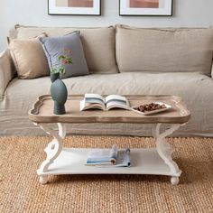 a coffee table with an open book on it