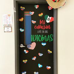 a door decorated with magnets that say i love you in spanish and an american flag