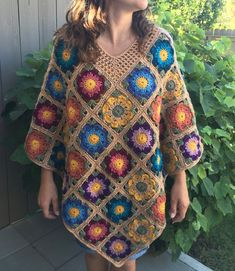 This bright, bold, rich, colorful poncho will be an eye catching, yet functional and warm piece to wear when you want an extra layer on a chilly day. It is versatile, and can be worn in any season, with a turtleneck or tank top.    Fits women Size Small to XL. Fits loosely on smaller women and more snuggly on larger women.  This is an average length poncho that is 3/4-sleeve.  This poncho measures approximately:   - 40 inches across from corner to corner -30 inches from V of neck to tip of the bottom -22 inches from neck down to the tip of the arm (The model is size small and 5'7" tall) -- Feels like you are wrapped in a warm shawl perfect for any season to throw over your summer outfit on a chilly day. This makes a great stylish addition to a plain outfit.  --The colors are earthy, yet br Bohemian Multicolor Poncho For Fall, Multicolor Bohemian Poncho For Fall, Bohemian Crochet Multicolor Poncho, Bohemian Multicolor Crochet Poncho, Multicolor Crochet Bohemian Poncho, Fall Bohemian Poncho With Granny Squares, Multicolor Poncho For Spring, One Size, Bohemian Granny Square Poncho For Festivals, Multicolor One Size Poncho For Spring