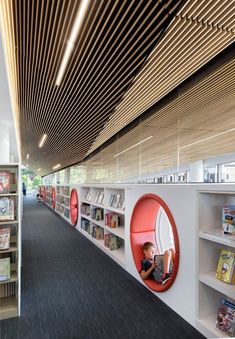 an empty library with bookshelves and circular window