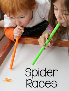 two young children are playing with their green and orange toothbrushes on the table