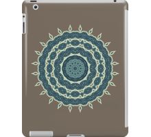 an ipad case with a blue and green design on the front, featuring a circular pattern