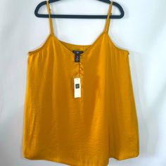 Tank Top By Gap. Mustard-Yellow-Gold. Xs Trendy Gap Summer Tank Top, Trendy Gap Tank Top For Summer, Yellow V-neck Tank Top For Beach, Yellow Tank Top For Spring Vacation, Yellow Tank Top For Vacation And Spring, Yellow Tank Top For Vacation In Spring, Casual Gold Sleeveless Tank Top, Casual Gold Sleeveless Top, Gold Sleeveless Casual Top