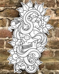 a drawing of a skull and flowers on a brick wall