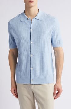 Crafted with subtle ribbing, this sweater-knit button-up pairs the softness of cotton with the smartness of a classic rolled collar. 26 1/2" length (size Medium) Spread collar Short sleeves 55% cotton, 45% acrylic Machine wash, dry flat Imported Collared Knit Tops For Business Casual, Knit Collared Tops For Business Casual, Knit Tops With Button Closure For Work, Collared Cotton Sweater With Button Closure, Relaxed Fit Textured Knit Button-up Top, Casual Knit Polo Sweater With Buttons, Textured Knit Relaxed Fit Button-up Top, Textured Knit Button-up Top With Relaxed Fit, Collared Knit Tops With Button Closure