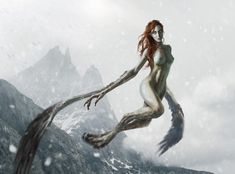 a woman with red hair is flying through the air in front of snow covered mountains