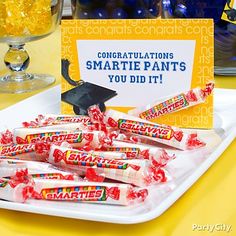 congratulationss for smartie pants you did it on a plate with candy and graduation cap