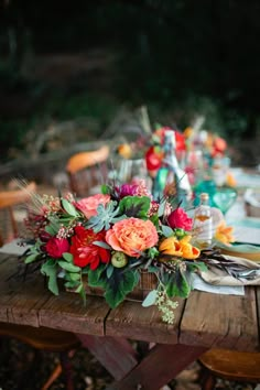 a table with flowers on top of it and the words weddingomania com below