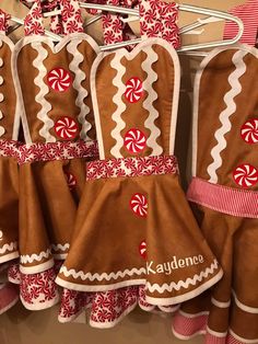 several oven mitts with candy canes on them