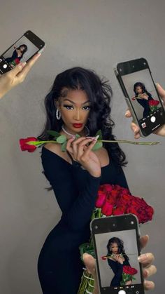 a woman holding up two cell phones in front of her face with roses on them