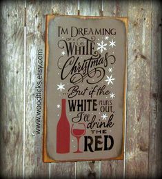 a sign that says i'm dreaming white christmas but if the wine is out, i'll drink the red