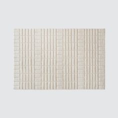 a white rug with lines on it