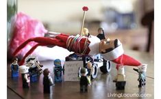 a group of small toy figurines sitting on top of a table