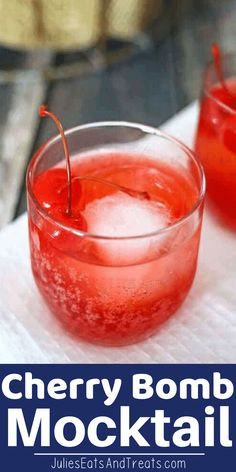 two glasses filled with cherry bomb mocko cocktail on top of a white napkin next to a