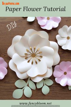 paper flowers on a wooden table with text overlay that reads diy paper flower bouquet