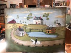 a painting of a person riding a horse in front of a house with a pond